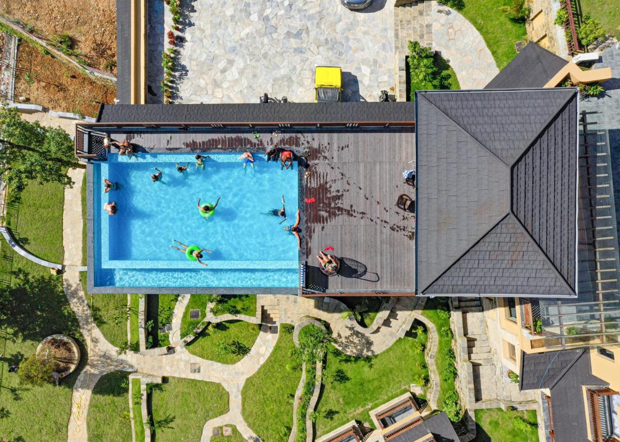 Bar Peepal Resort โพคารา ภายนอก รูปภาพ Aerial view of the pool