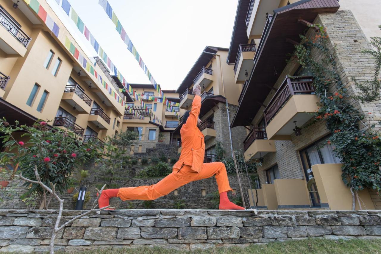 Bar Peepal Resort โพคารา ภายนอก รูปภาพ A student of the Drepung Loseling Nunnery, practicing yoga.