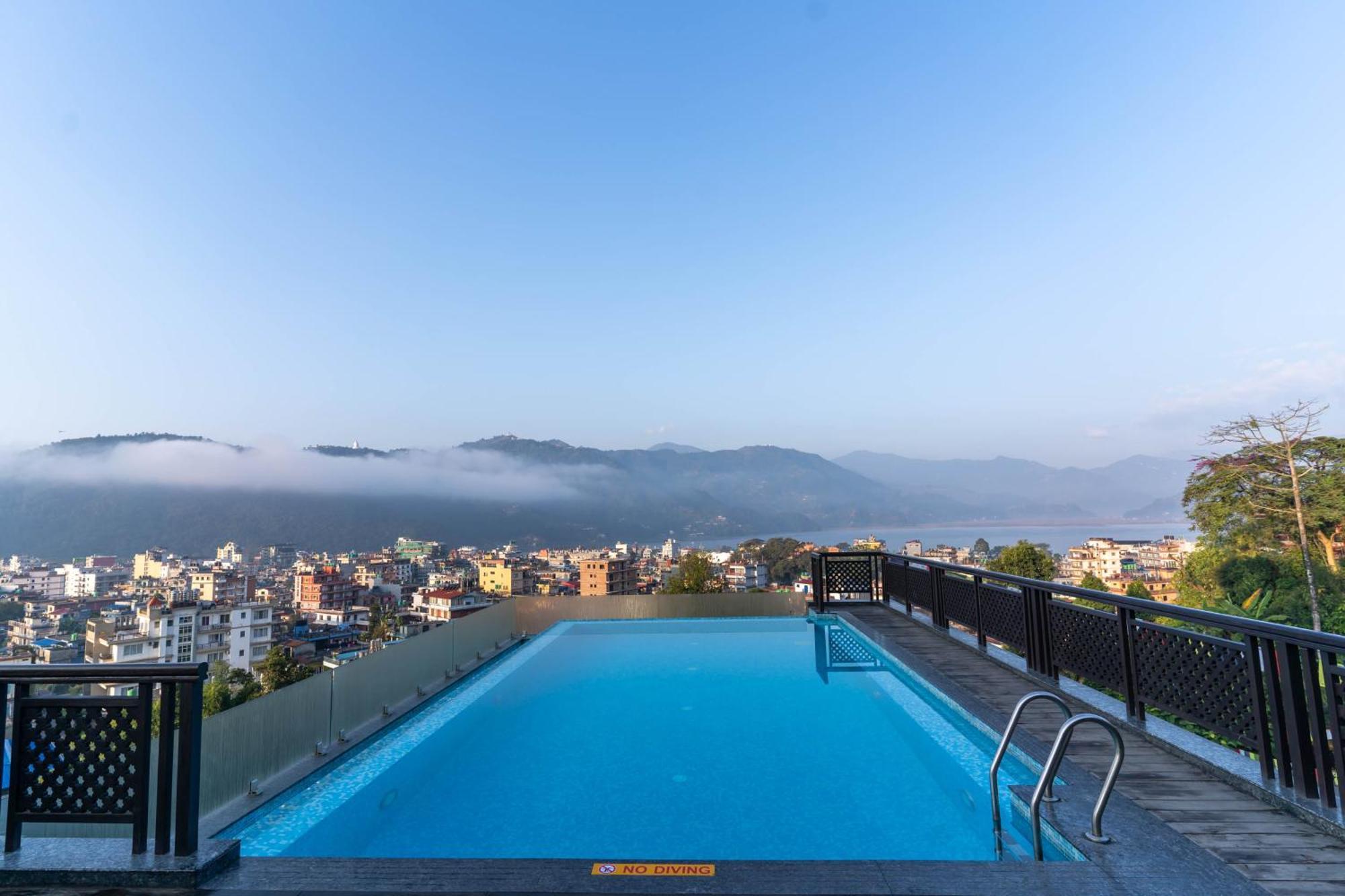Bar Peepal Resort โพคารา ภายนอก รูปภาพ View of the city from the hotel